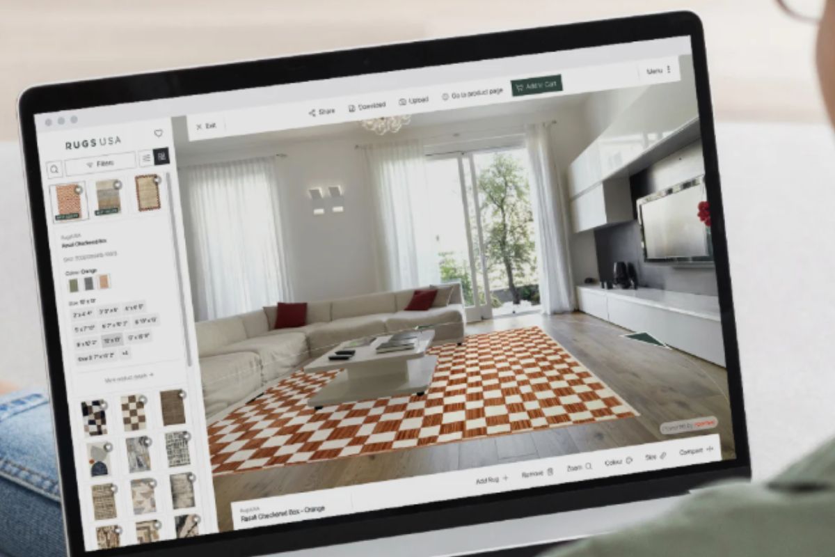 Buying a Moroccan Rug Online: What the Photos Hide Laptop displaying a Moroccan textile website while resting among physical Moroccan rugs and textiles