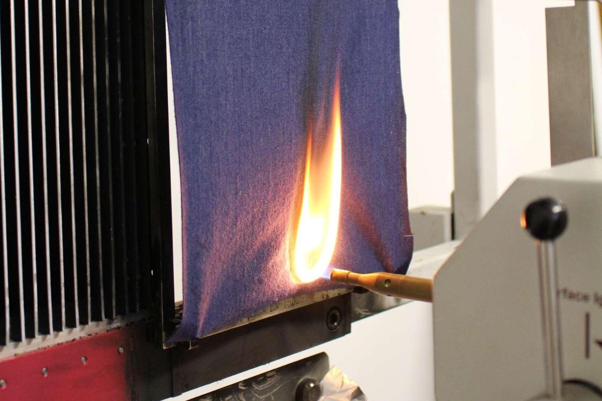 The Rug Burn Test: What It Proves, and Doesn't Textile specimen undergoing a controlled laboratory flammability test.
